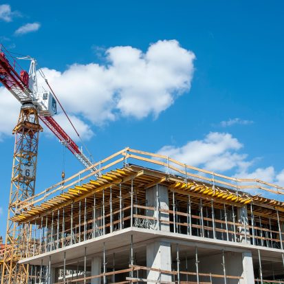 Apartment building under construction on a sunny day